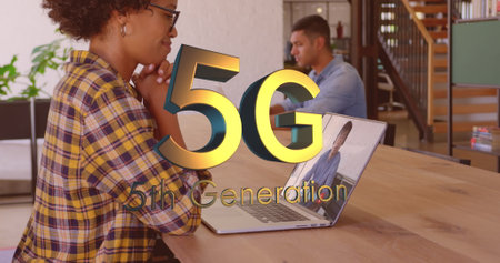 A biracial young professional using laptop, displaying 5G 5th Generation. An Asian manager working...