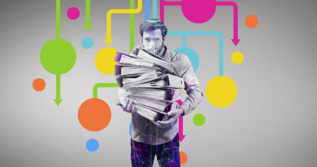 White man with several newspapers, surrounded by colorful abstract lines and dots. He has short dark hair, wearing casual jacket, looking at papersの写真素材