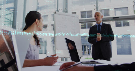 Statistical data processing over diverse business people discussing in meeting room at office....