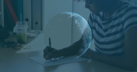 Image of financial data processing and globe over businessman working in office. Global business, finance, computing, connections and data processing concept digitally generated image.の写真素材