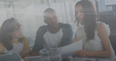 Image of financial data processing over business people in office. Global business finances...