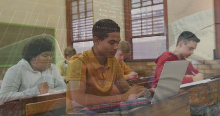 Image of data processing over diverse students using laptop. Global education and digital interface concept digitally generated image.の写真素材