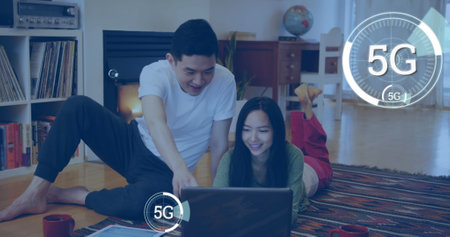 Image of multiple digital 5G icons over couple using laptop at home. Global online network digital...