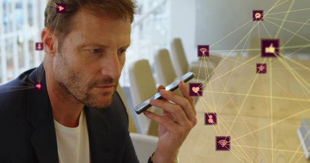 Image of connected icons globes over caucasian man talking on speaker of cellphone. Digital...