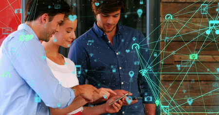 Image of connected icons globes over diverse coworkers discussing and using smartphone. Digital...