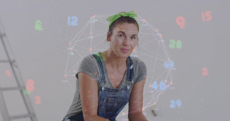 Image of network of connections and numbers over happy caucasian woman doing redecoration. global...
