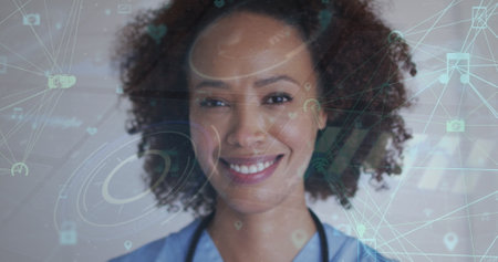 Image of network of connections with icons over biracial woman smiling at camera. global connections, technology and digital interface concept digitally generated image.の写真素材
