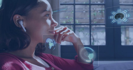 Biracial young adult woman wearing red sweater, studying holographic displays. Dark-haired, using...