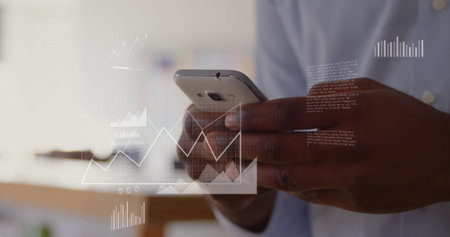 Image of data processing over african american man using smartphone. Global business and digital interface concept digitally generated image.の写真素材