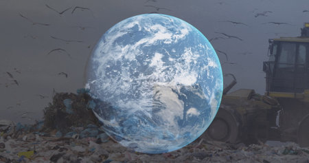 Image of globe over bulldozer in waste disposal site. environment, global warming and climate change concept digitally generated image.の写真素材