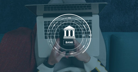 Image of data processing and bank symbol over caucasian man using smartphone. Global finance, business, connections, computing and data processing concept digitally generated image.の写真素材