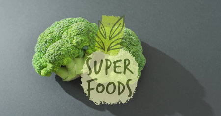 Broccoli with SUPER FOODS text image over green leaf graphic. Nutrition, healthy, diet, wellness, vegetables, plant-basedの写真素材