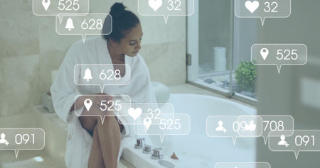 Image of social media notifications over biracial woman in robe running bath. Lifestyle, self care,...