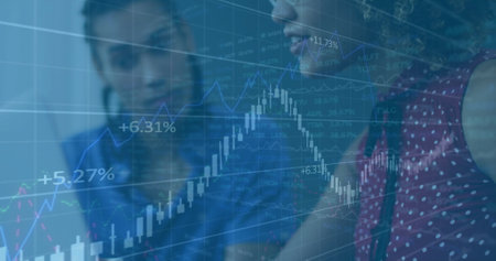 Financial data and stock market analysis image over person using laptop