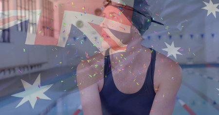 Image of confetti over caucasian female swimmer and flag of australiaの写真素材