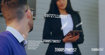 Image of numbers processing over diverse business people in office