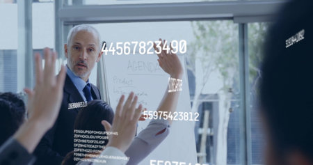 Image of numbers processing over diverse business people in officeの写真素材