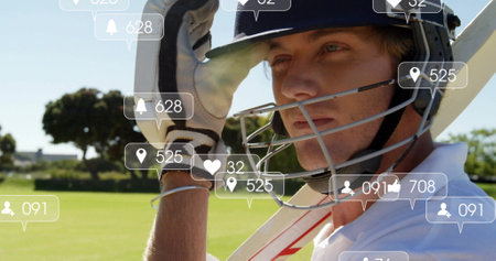 Image of social media icons with growing numbers over caucasian male cricket playerの写真素材
