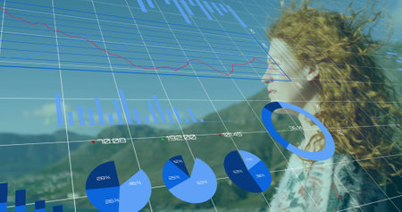 Image of financial data processing over caucasian woman and landscapeの写真素材