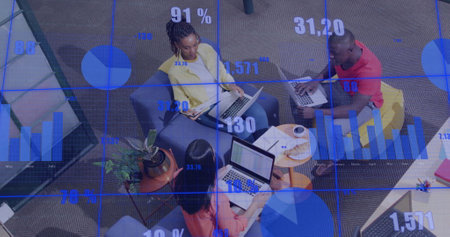 Image of financial data processing over diverse business people in officeの写真素材