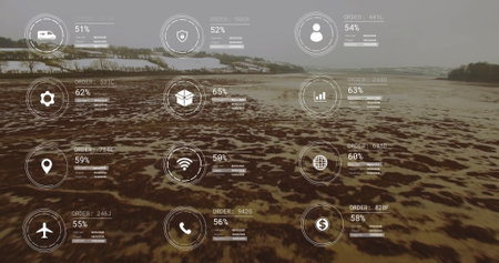 Image of network of icons and data processing over landscape. Global connections, computing and data processing concept digitally generated image.の写真素材