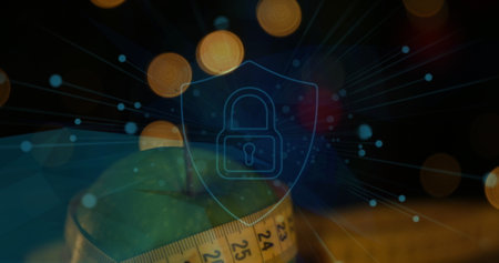 Image of padlock and shield icon with lens flares over granny smith apple and measuring tape....