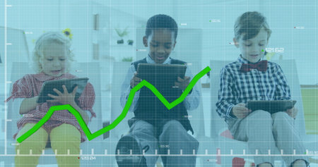 Image of graph with changing numbers over diverse children using digital tablet in classroom. Digital composite, multiple exposure, report, business, growth, childhood and technology concept.の写真素材