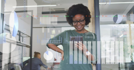 Image of financial data processing over african american businesswoman. global business, technology and digital interface concept digitally generated image.の写真素材
