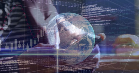 Image of globe, binary coding and financial data processing over caucasian man using smartphone. Global business, connections, networks and data processing concept digitally generated image.の写真素材