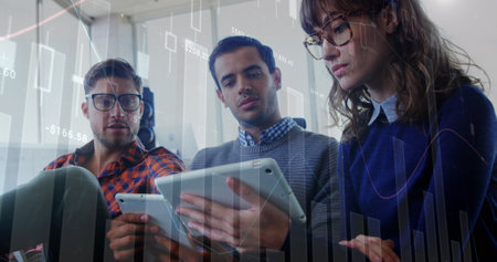 Image of data processing over diverse colleagues discussing over digital tablet at office. Business...