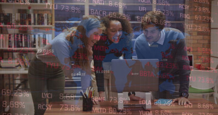 Image of stock market data processing over three diverse colleagues discussing over laptop. Global economy and business technology conceptの写真素材