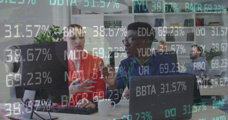 Image of stock market data processing over diverse man and woman discussing at office. Global...