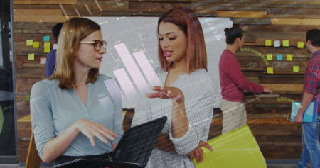 Image of financial data processing over two diverse businesswomen. Global business, finances, data processing and digital interface concept digitally generated image.の写真素材
