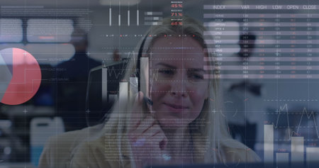 Statistical data processing over caucasian female customer care executive talking on phone headset. Business data and analytics technology conceptの写真素材