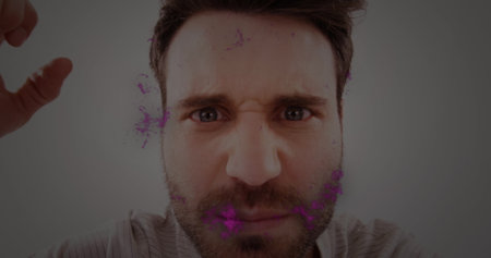 Image of pink flames over angry caucasian man. mental health awareness week and celebration concept digitally generated image.の写真素材