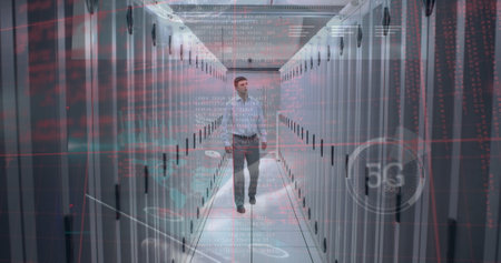 Multiple screens with data processing against caucasian male engineer walking in server room. Business data storage technology conceptの写真素材