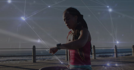 Image of network of connections over woman running exercising in forest. Sport and competition...