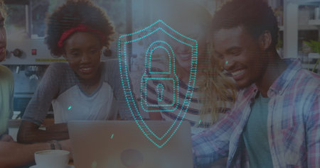 Image of padlock over diverse friends using laptop. Global business and digital interface concept, digitally generated image.の写真素材