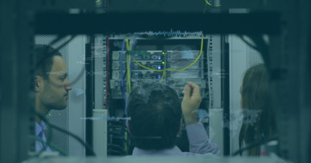 Image of data processing over team of diverse engineers working at computer server room. Computer...