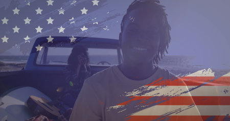 Image of American flag drawn over biracial couple on beach by seaside on summer holiday road trip,...