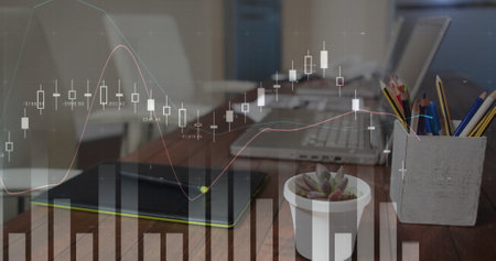 Digital image of graphs moving in the screen with a background of a work space with a cup of coffee,...
