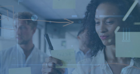 Image of data processing over diverse business people taking notes. global business, finances,...