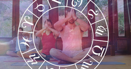 Image of horoscope zodiac wheel over diverse people practicing yoga. Star signs, horoscope and yoga...