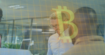 Image of bitcoin symbol and data processing over diverse business people in office. Global cryptocurrency, business, connections, computing and data processing concept digitally generated image.の写真素材