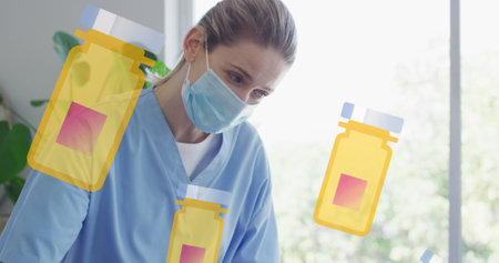 Image of box with pills icons over senior caucasian woman and nurse exercising. medical and healthcare services concept digitally generated image.の写真素材