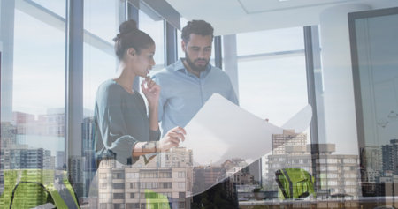 Image of cityscape over diverse male and female business colleagues talking in office. global...
