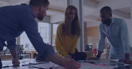 Image of data processing over diverse business people in office. Global business, digital interface, computing and data processing concept digitally generated image.の写真素材