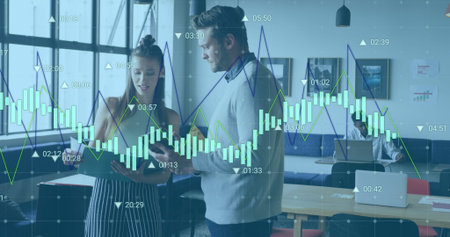 Image of graphs and changing numbers over caucasian coworkers sharing ideas in office. Digital...