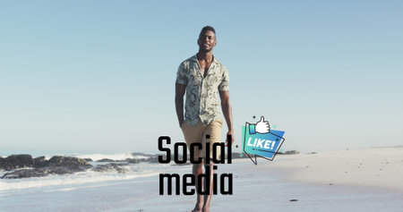 Image of social media over happy african american man walking on beach. Social media, communication, holiday and relax concept digitally generated image.の写真素材