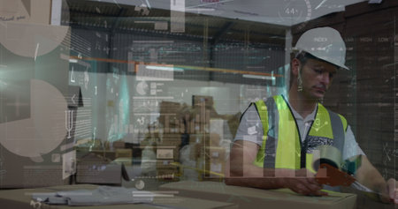 Image of statistical data processing over caucasian male worker packing boxes at warehouse. Logistics business and technology conceptの写真素材